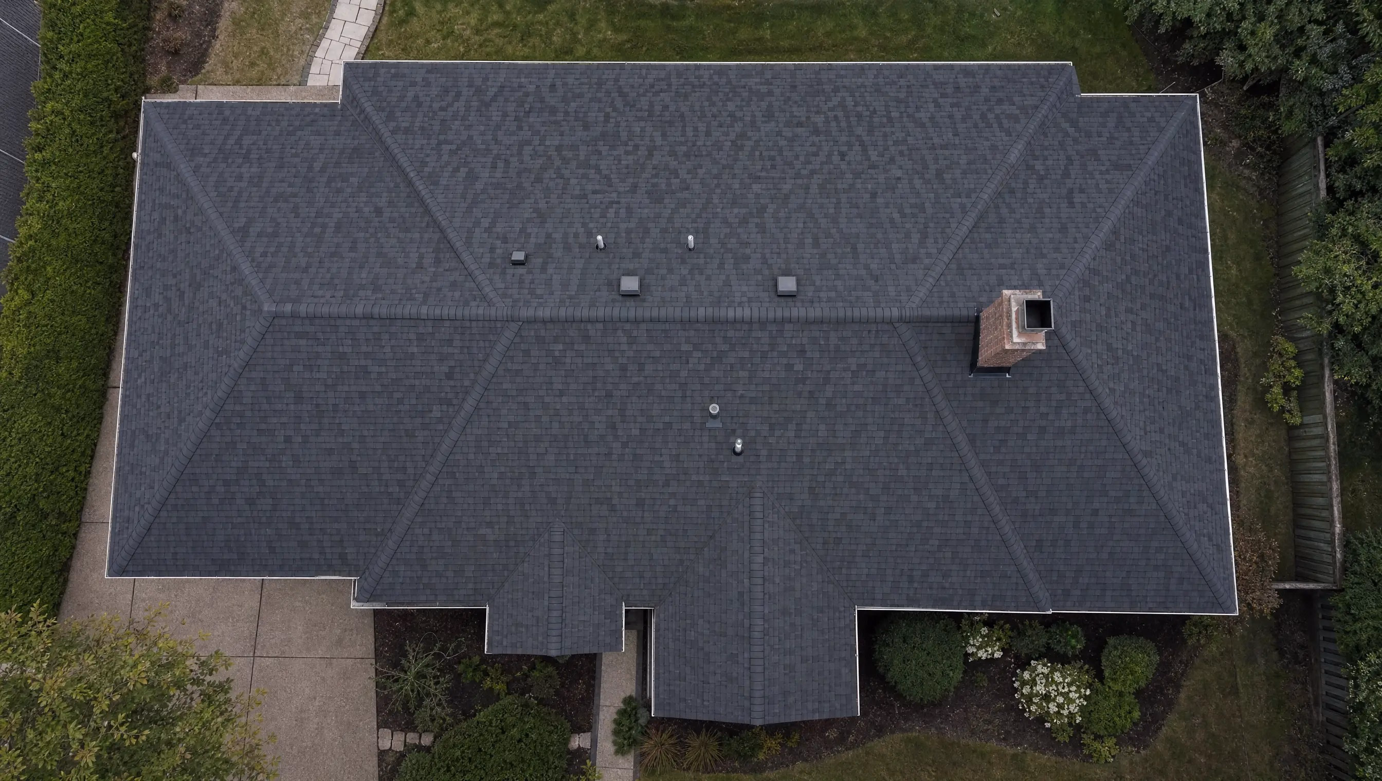 Top-down drone view of a residential roof during an AI damage inspection